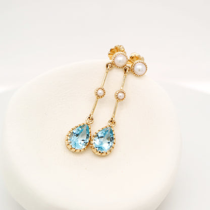 Freshwater pearl with blue topaz drop earrings in 9k yellow gold