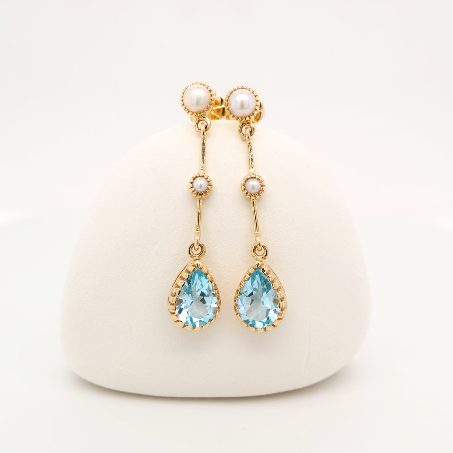 Freshwater pearl with blue topaz drop earrings in 9k yellow gold
