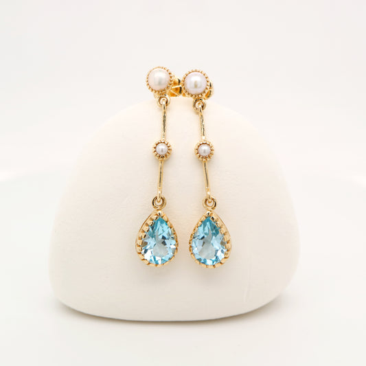 Freshwater pearl with blue topaz drop earrings in 9k yellow gold
