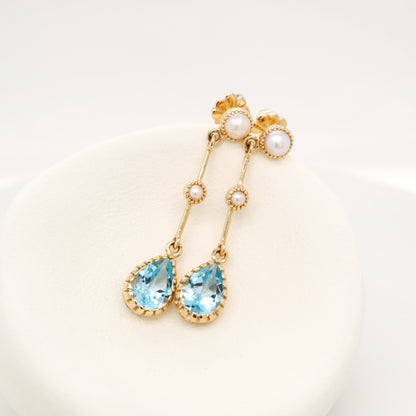 Freshwater pearl with blue topaz drop earrings in 9k yellow gold