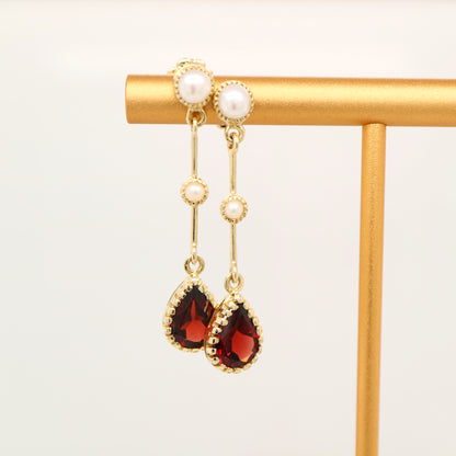 Freshwater pearl with garnet drop earrings in 9k yellow gold