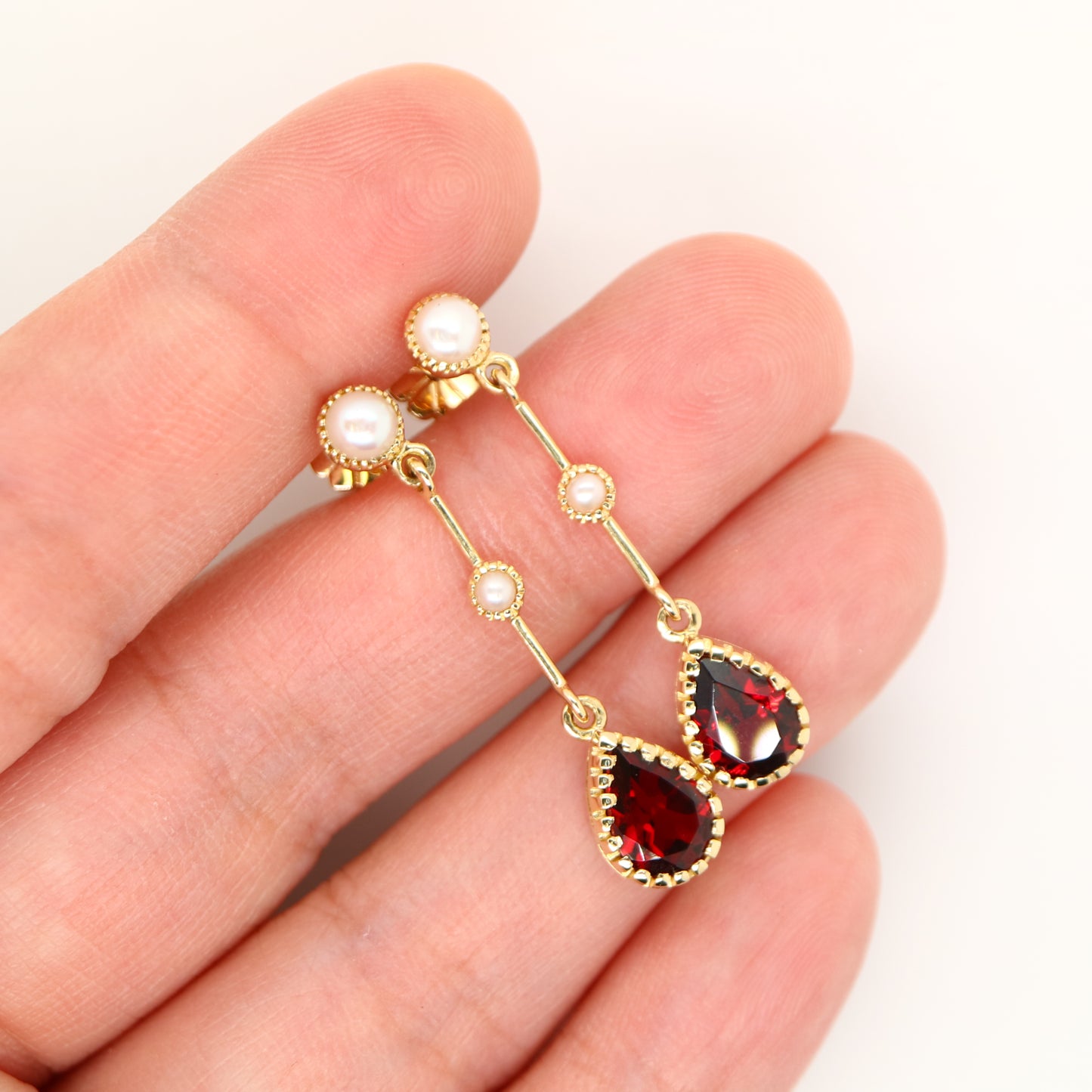 Freshwater pearl with garnet drop earrings in 9k yellow gold