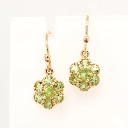 Daisy hook earrings with peridot in 9k yellow gold