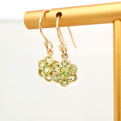 Daisy hook earrings with peridot in 9k yellow gold