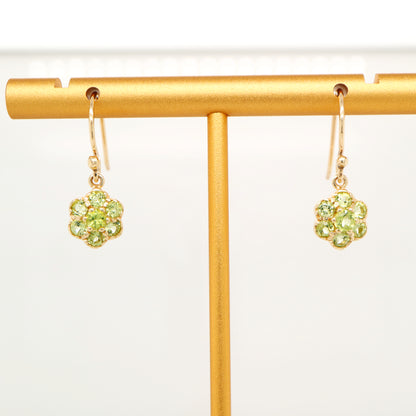 Daisy hook earrings with peridot in 9k yellow gold