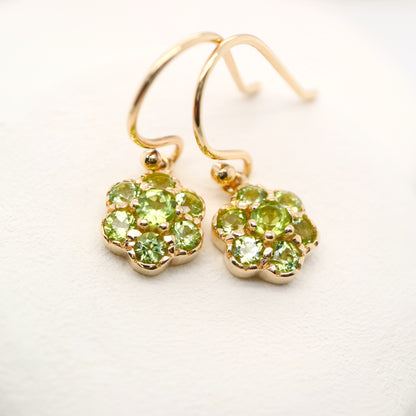 Daisy hook earrings with peridot in 9k yellow gold
