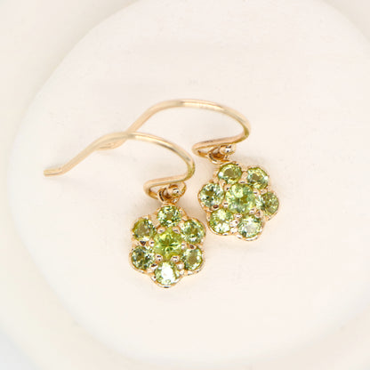 Daisy hook earrings with peridot in 9k yellow gold