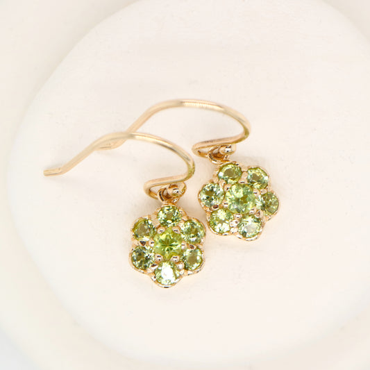 Daisy hook earrings with peridot in 9k yellow gold