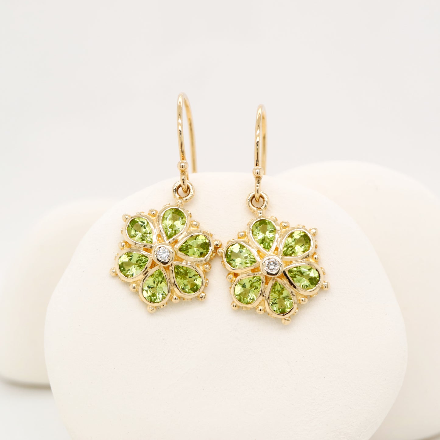 Peridot petal flower earrings with natural diamond in 9k yellow gold