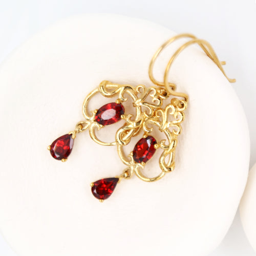 Art nouveau style earrings with garnet in 9k yellow gold