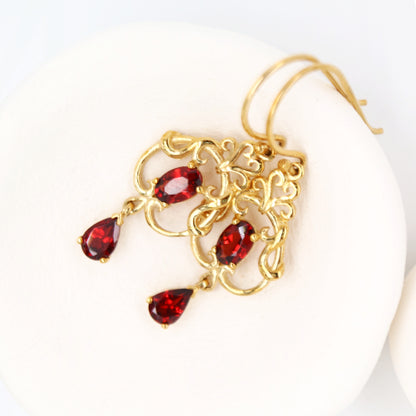 Art nouveau style earrings with garnet in 9k yellow gold