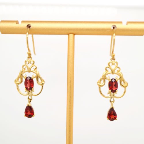 Art nouveau style earrings with garnet in 9k yellow gold