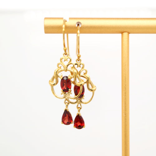 Art nouveau style earrings with garnet in 9k yellow gold