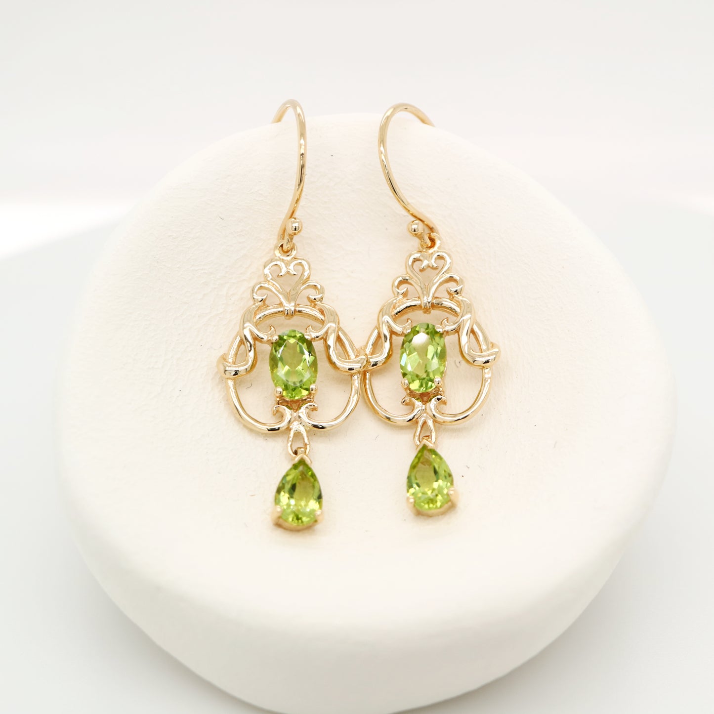 Art nouveau style earrings with peridot in 9k yellow gold