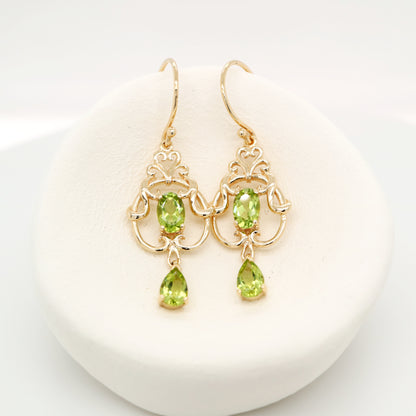 Art nouveau style earrings with peridot in 9k yellow gold