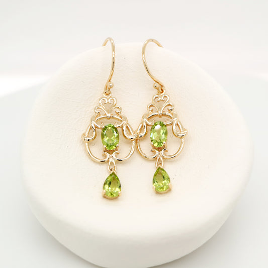 Art nouveau style earrings with peridot in 9k yellow gold