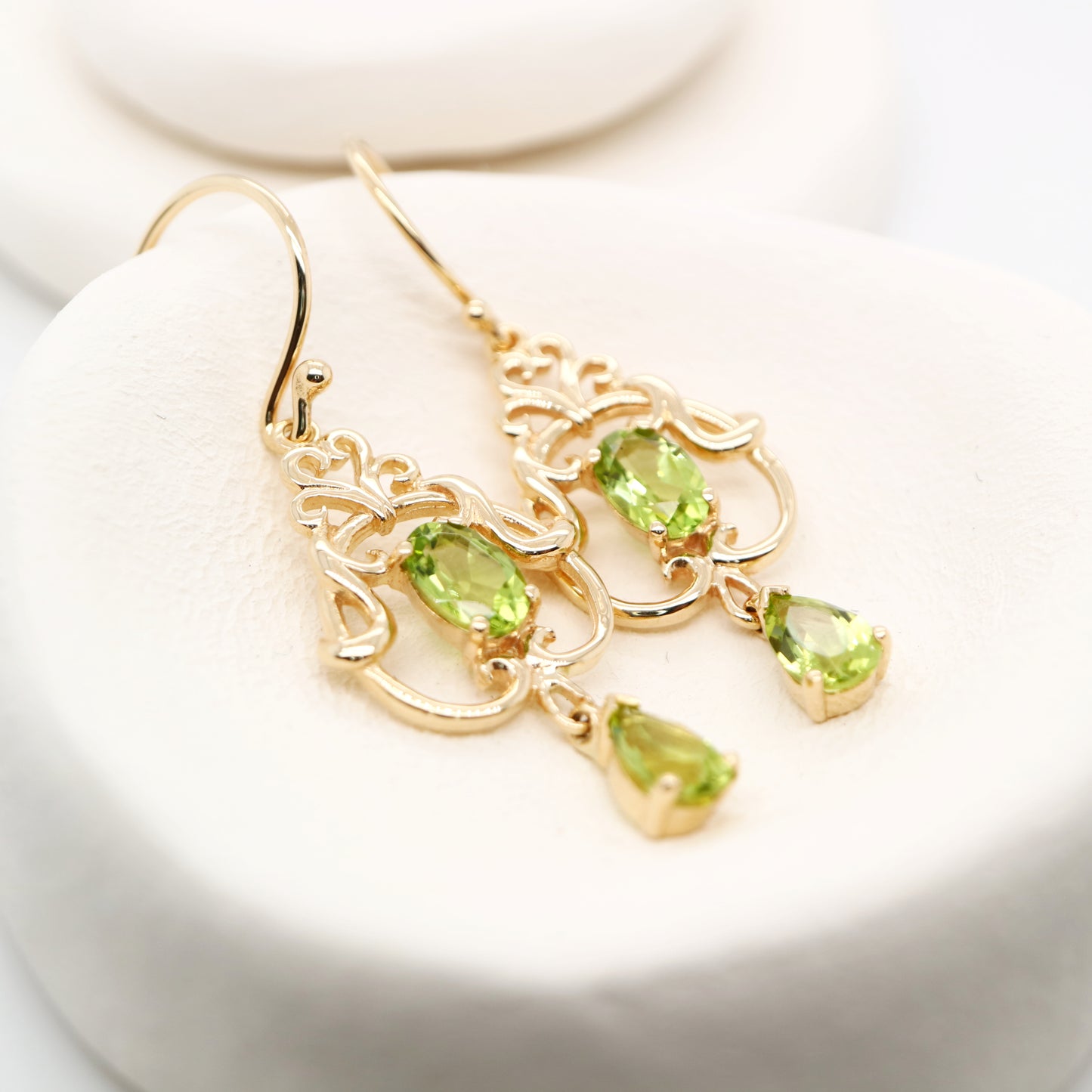 Art nouveau style earrings with peridot in 9k yellow gold