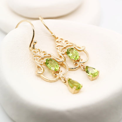 Art nouveau style earrings with peridot in 9k yellow gold
