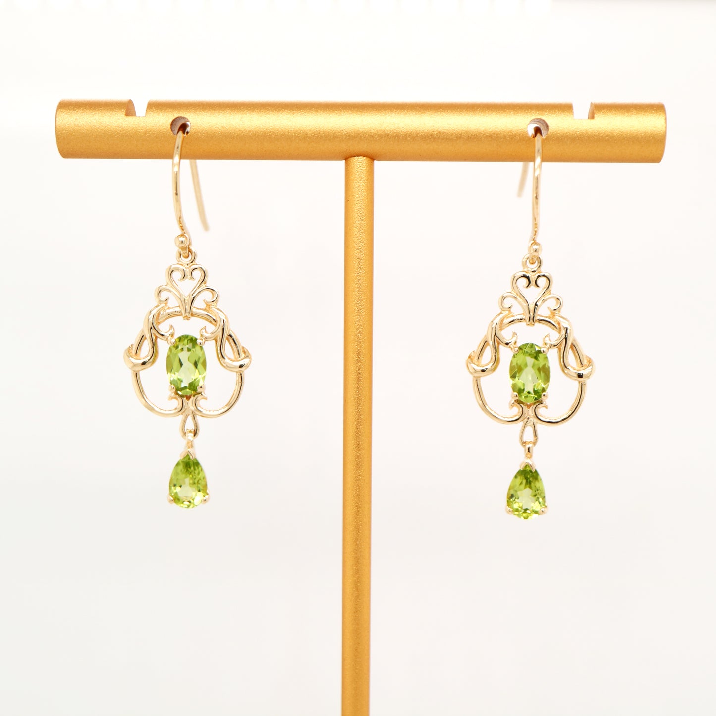 Art nouveau style earrings with peridot in 9k yellow gold
