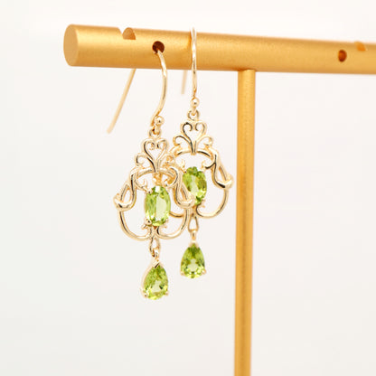 Art nouveau style earrings with peridot in 9k yellow gold