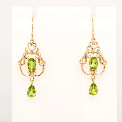 Art nouveau style earrings with peridot in 9k yellow gold