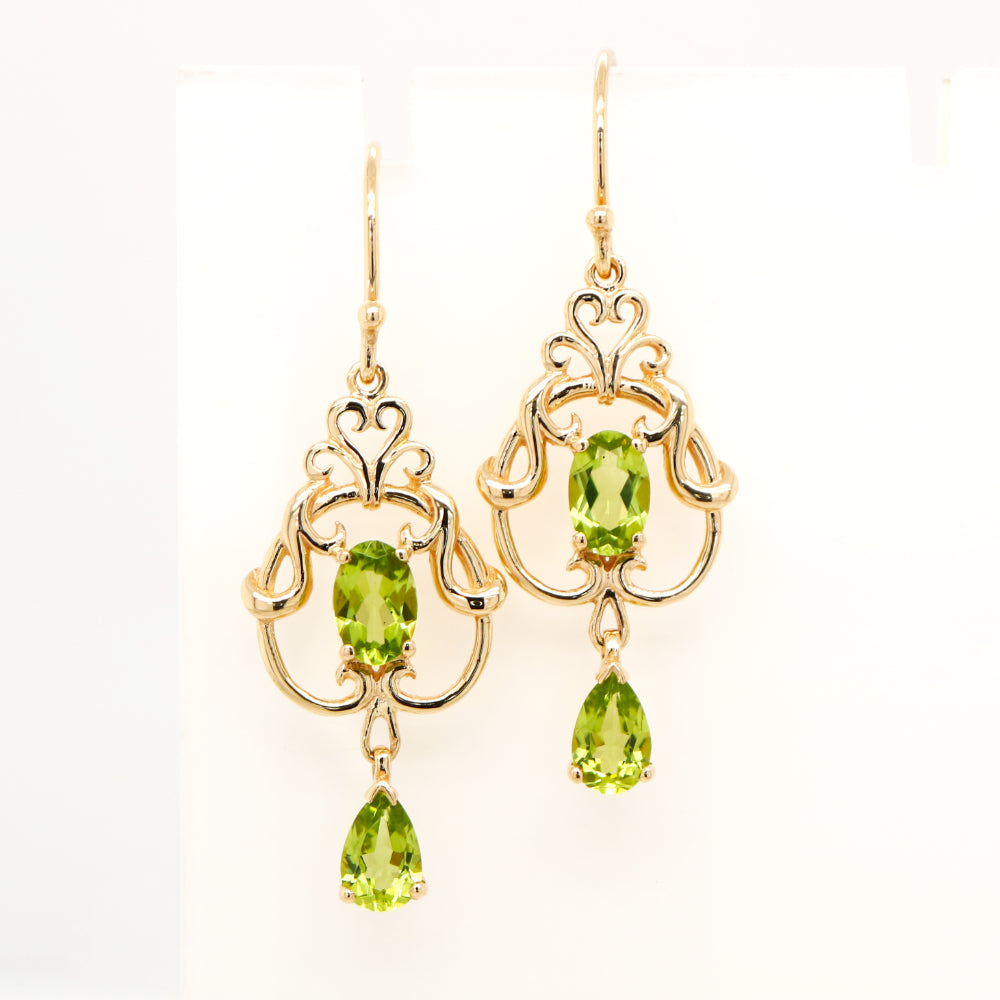 Art nouveau style earrings with peridot in 9k yellow gold