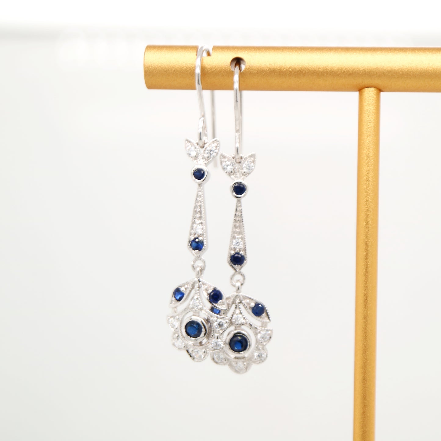 Floral drop earrings with laboratory grown blue sapphire and cz in sterling silver