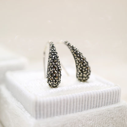 Curve hook style earrings with marcasite in sterling silver