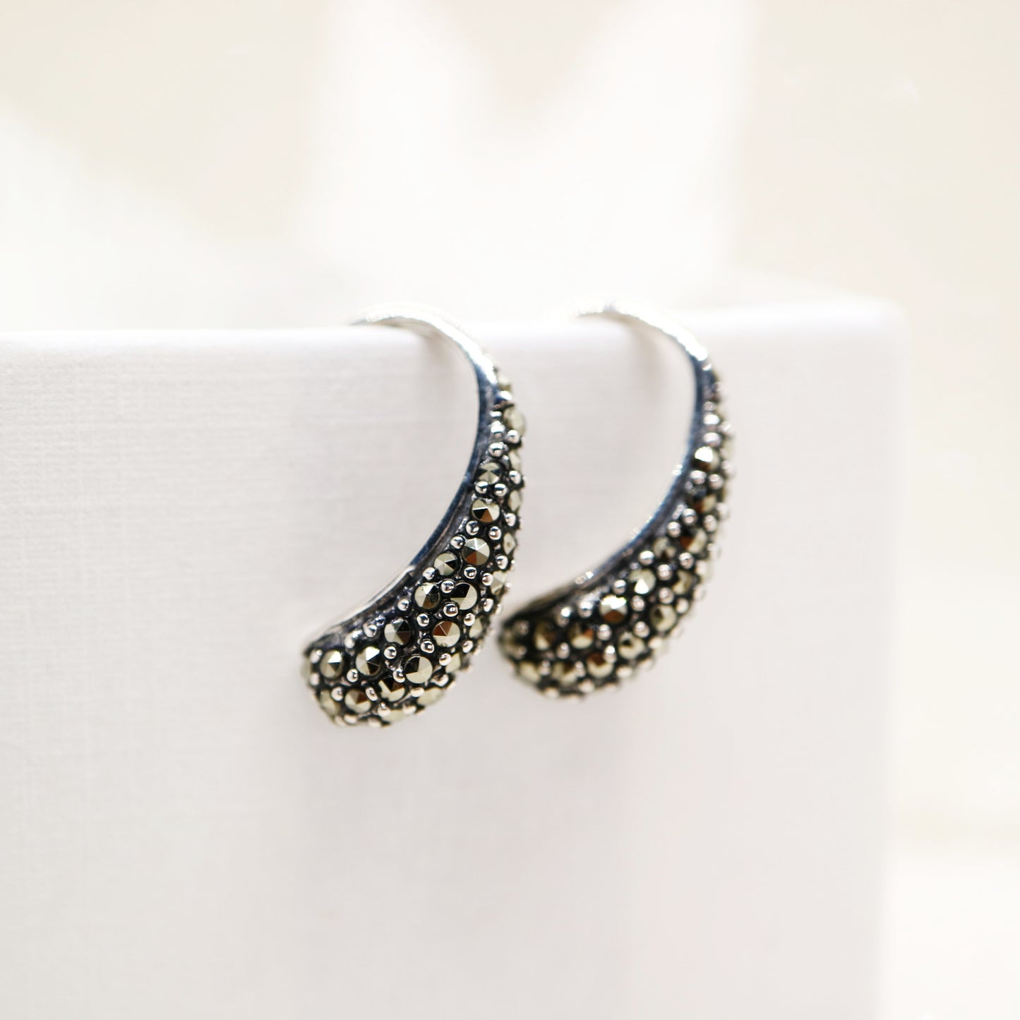 Curve hook style earrings with marcasite in sterling silver