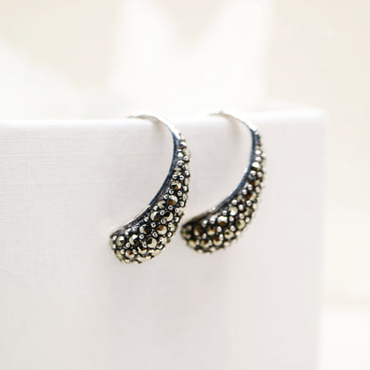 Curve hook style earrings with marcasite in sterling silver