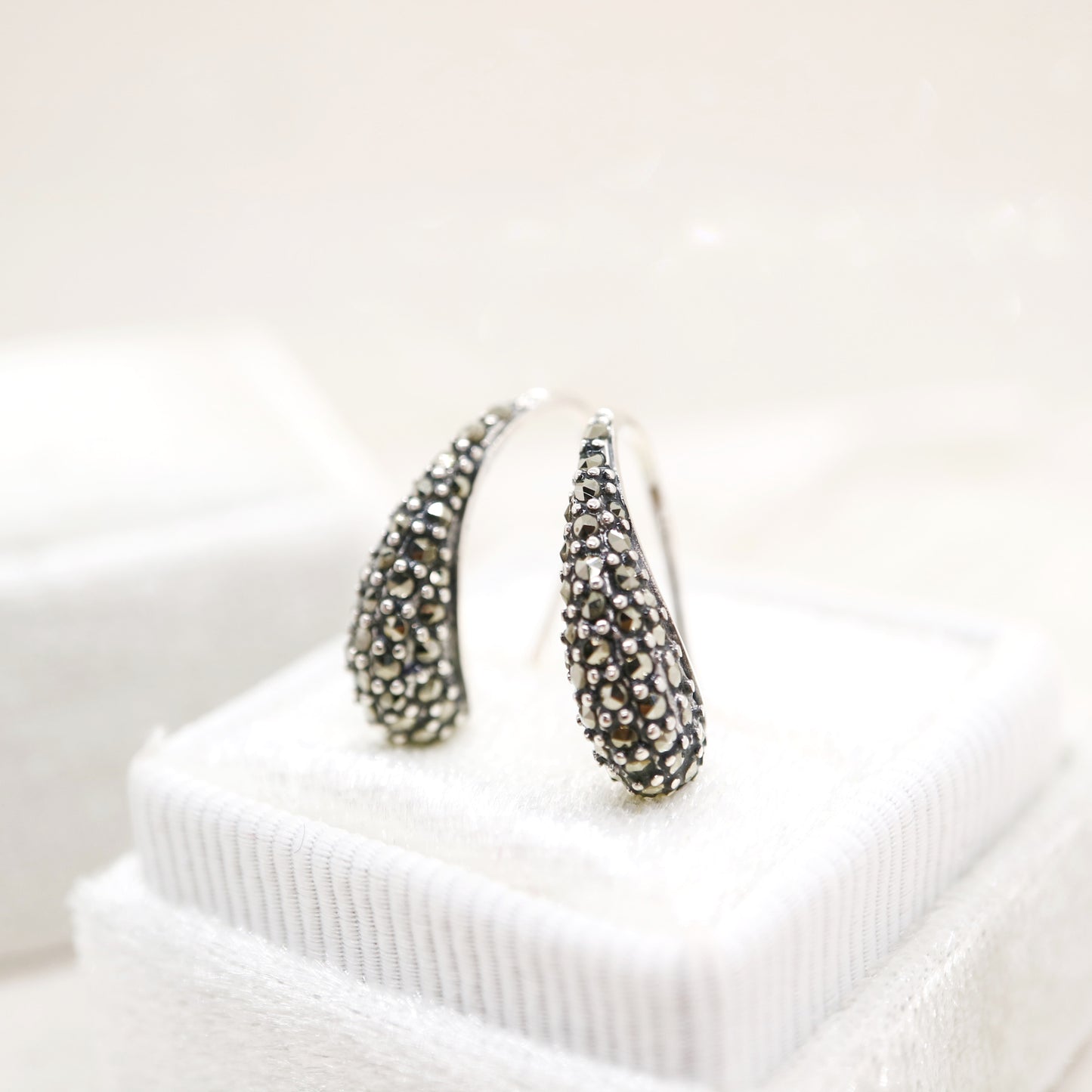 Curve hook style earrings with marcasite in sterling silver