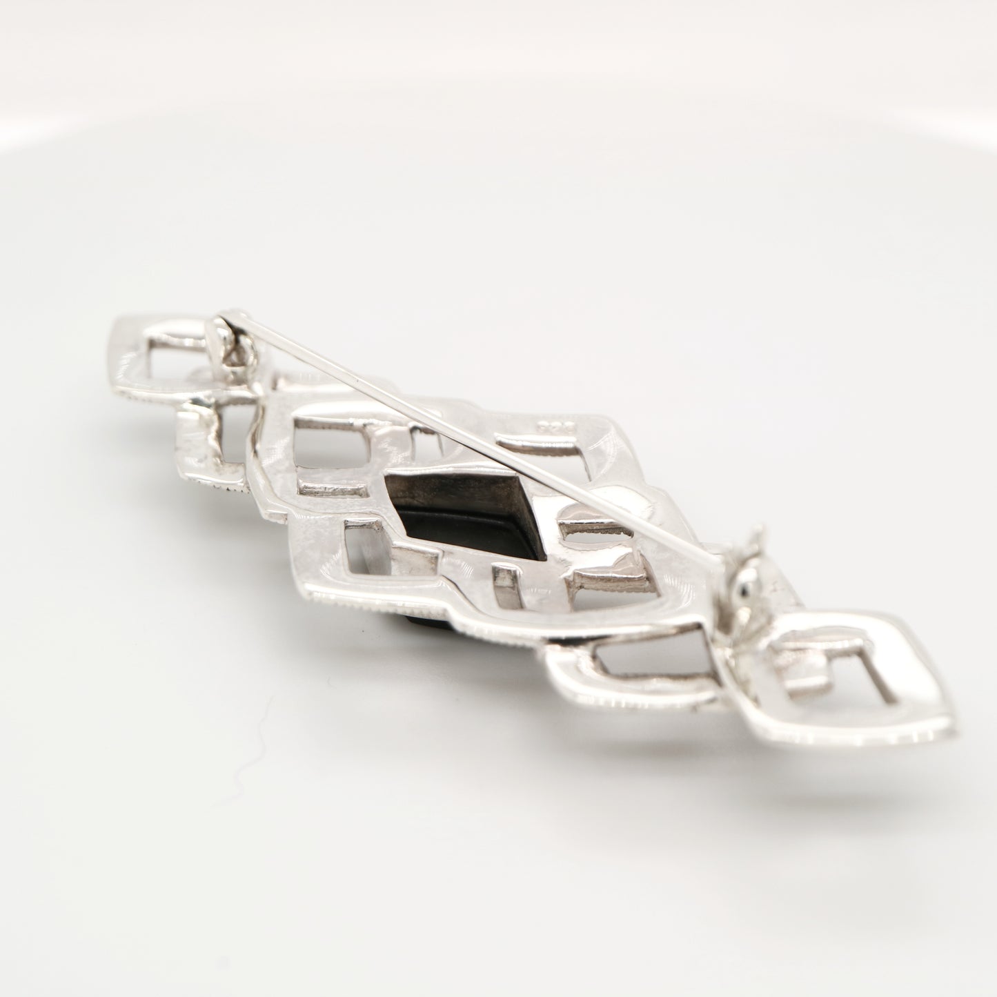 Art deco tesselated brooch with marcasite and onyx in sterling silver