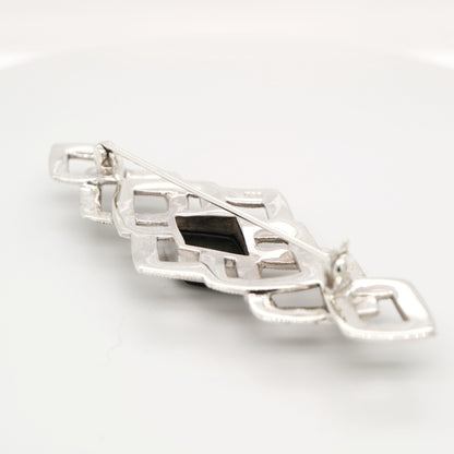 Art deco tesselated brooch with marcasite and onyx in sterling silver