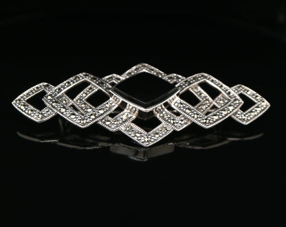 Art deco tesselated brooch with marcasite and onyx in sterling silver