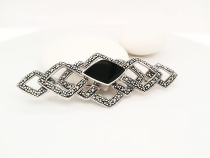 Art deco tesselated brooch with marcasite and onyx in sterling silver