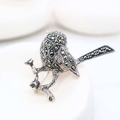 Fairywren marcasite brooch in sterling silver with garnet eye
