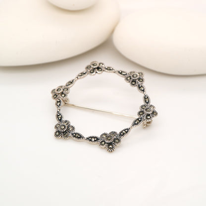 Flower hoop brooch in marcasite and silver