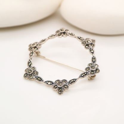 Flower hoop brooch in marcasite and silver