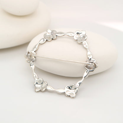 Flower hoop brooch in marcasite and silver
