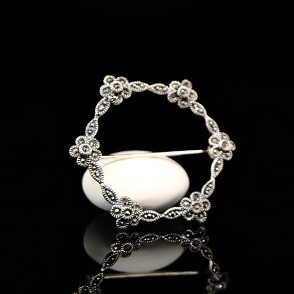 Flower hoop brooch in marcasite and silver
