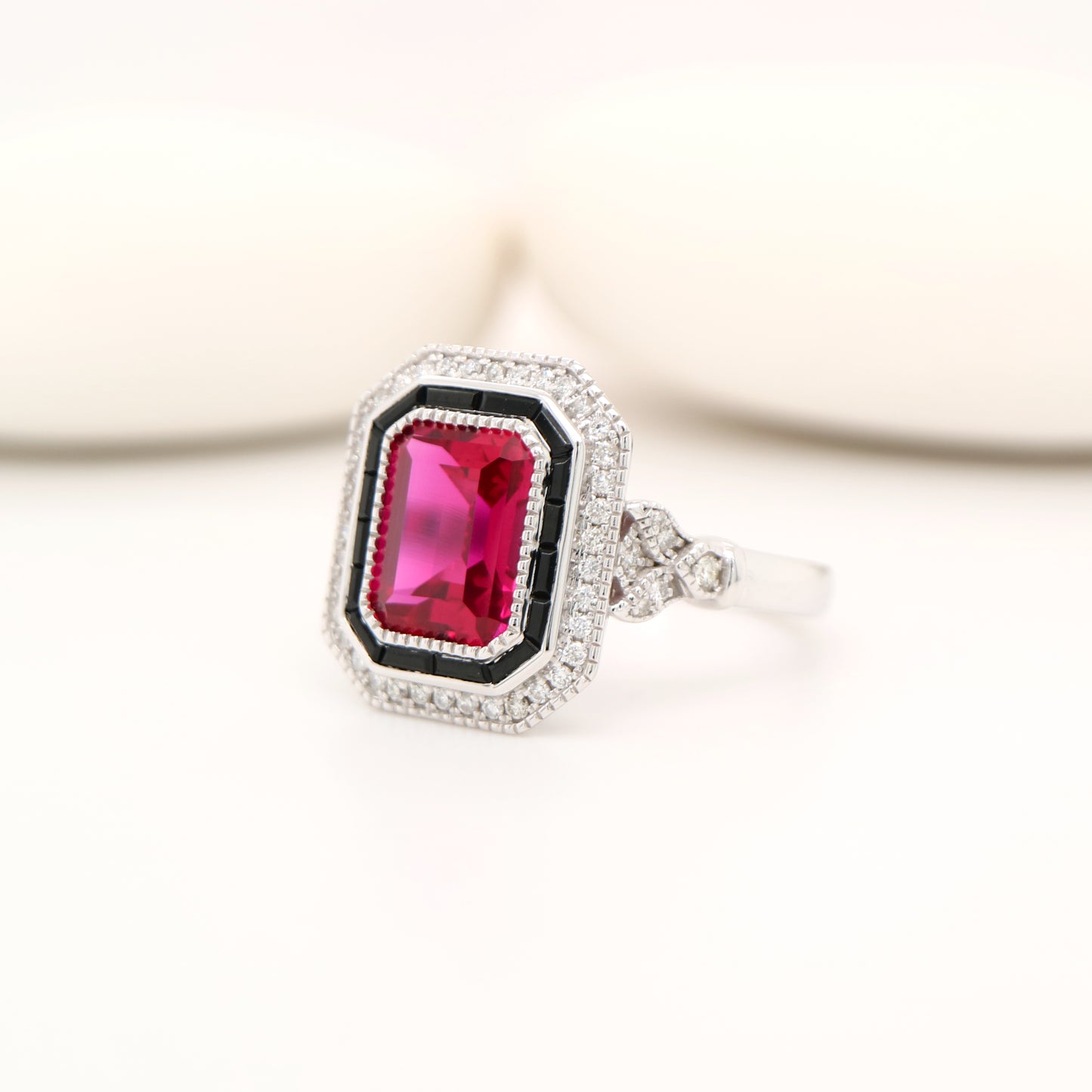 Art deco ring with laboratory grown ruby, onyx and cz halo in sterling silver