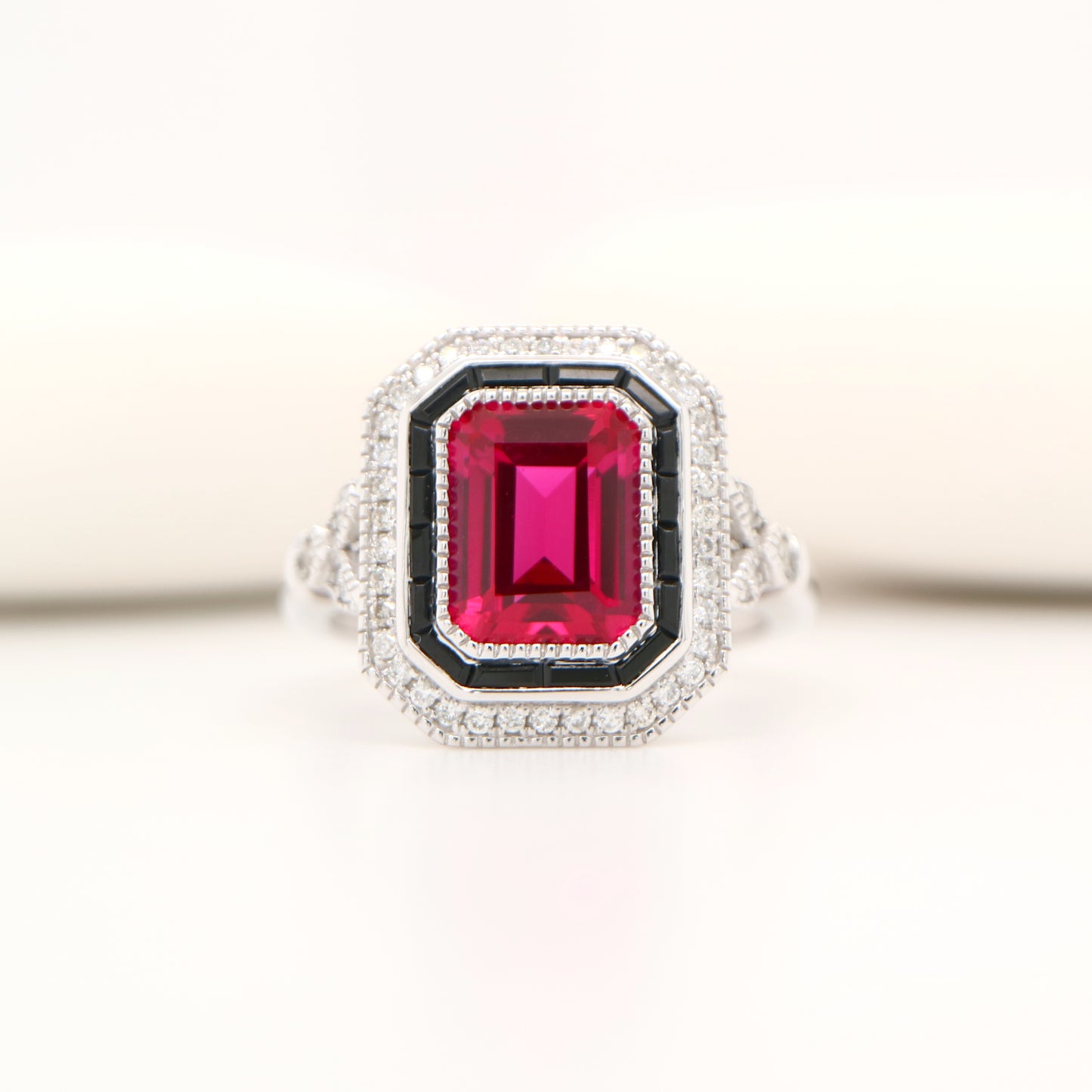 Art deco ring with laboratory grown ruby, onyx and cz halo in sterling silver