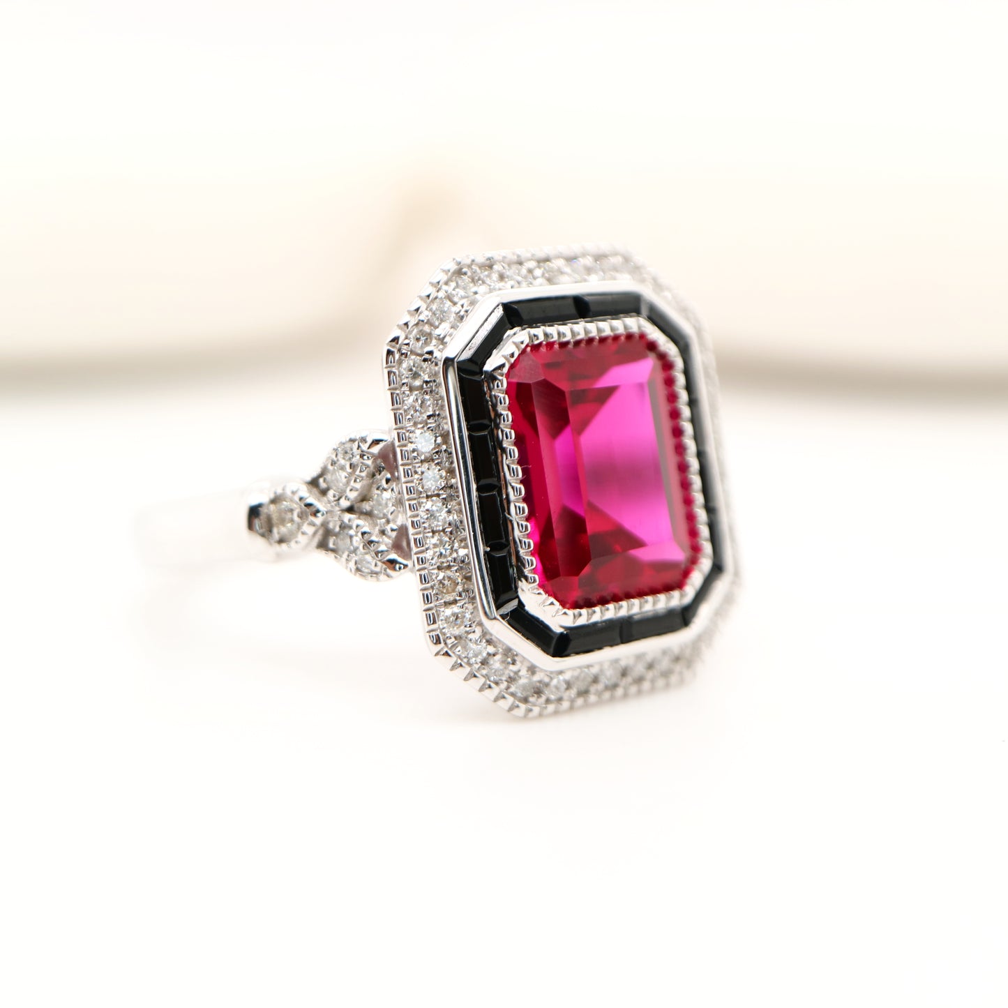 Art deco ring with laboratory grown ruby, onyx and cz halo in sterling silver