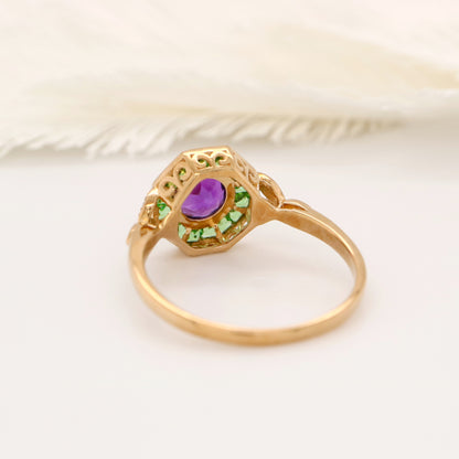 Target ring with channel set tsavorite garnet and amethyst with diamonds on the band in yellow gold