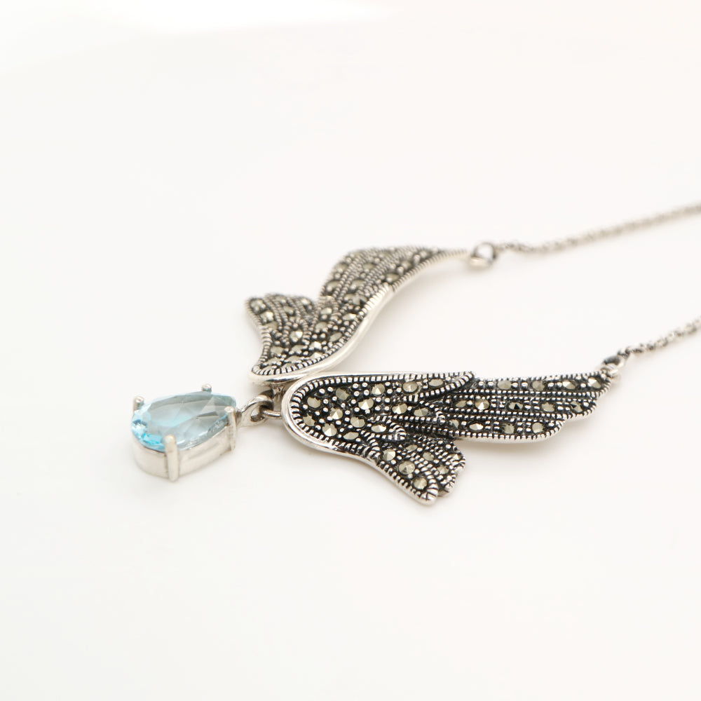 Angel Wing necklace in Silver with Marcasite and Blue Topaz Drop