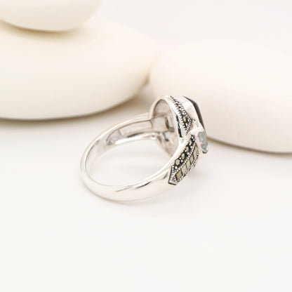 Silver lipped grey shell and pale blue topaz ring with marcasite and sterling silver
