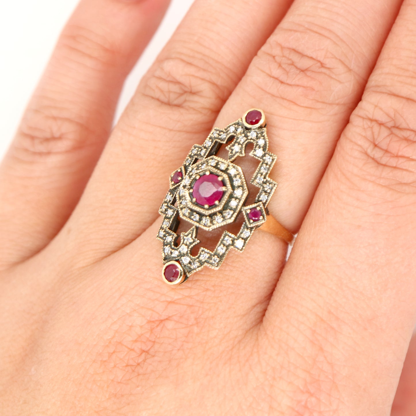 Oxidised gold cocktail ring with ruby and diamonds
