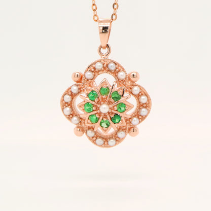 Pearl and tsavorite garnet pendant in 9k rose gold