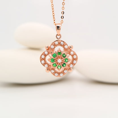 Pearl and tsavorite garnet pendant in 9k rose gold