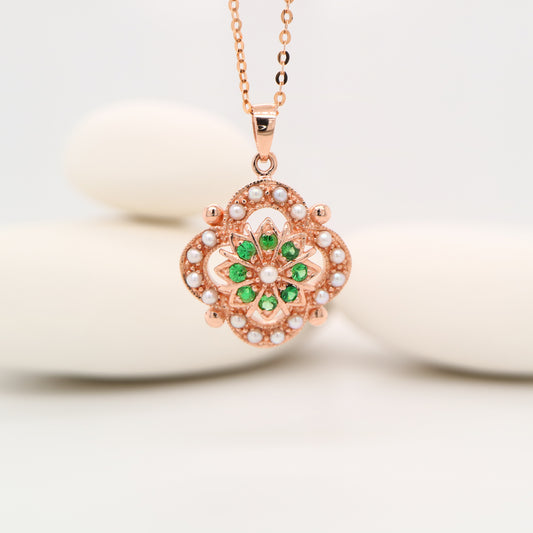 Pearl and tsavorite garnet pendant in 9k rose gold